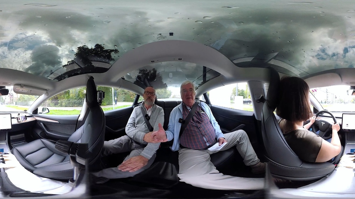 three persons sitting in a Tesla, 360 degree image